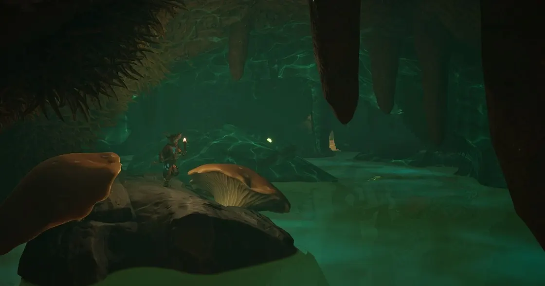 Personagem de Grounded 2 explora uma caverna submersa e iluminada em verde.